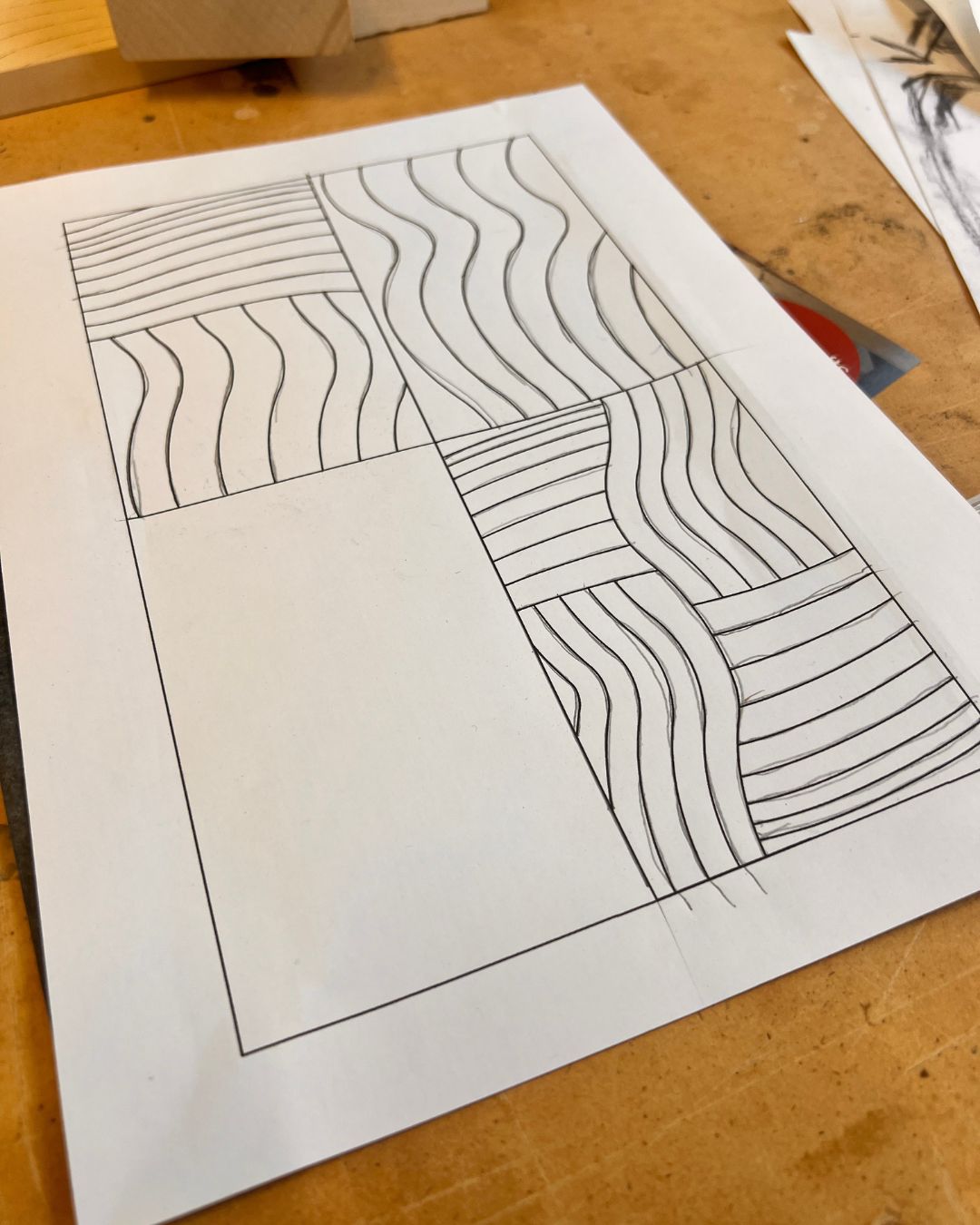 Paper template used to plan a relief-carving design