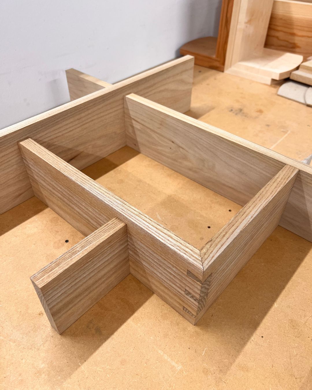 Mitred dovetail joinery on a student wall cabinet